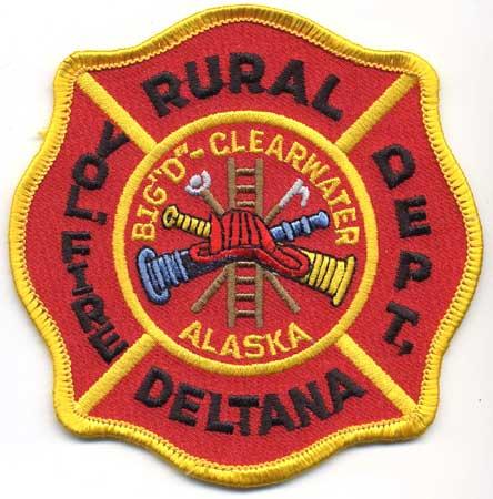 Deltana - Distintivo rosso con al centro un elmo