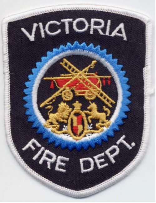 Victoria - Distintivo nero con al centro un mezzo antincendio e una scala