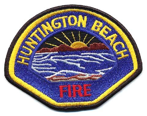 Huntington Beach - Distintivo blu con al centro mare e sole