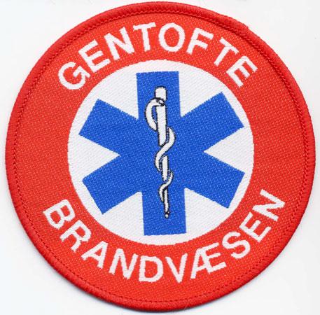 Gentofte - Distintivo rosso con al centro la croce medica azzurra