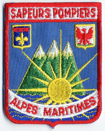 Alpes Maritimes - Distintivo azzurro con al centro montagne sole e mare