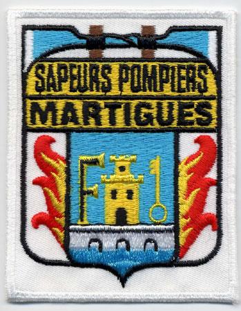 Martigues - Distintivo bianco con al centro una torre