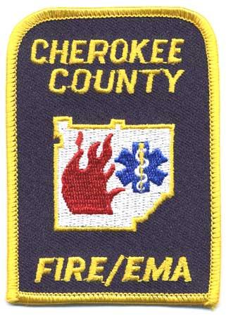 Cherokee County - Distintivo blu con al centro fiamme e la croce azzurra medica