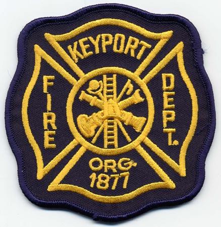 Keyport - Distintivo bero con al centro un elmo giallo e una scala