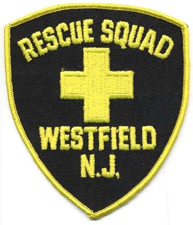 Westfield - Distintivo nero con al centro una croce gialla