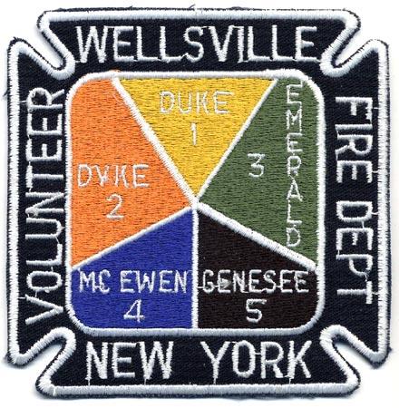 Wellsville - Distintivo nero giallo arancio verde e blu