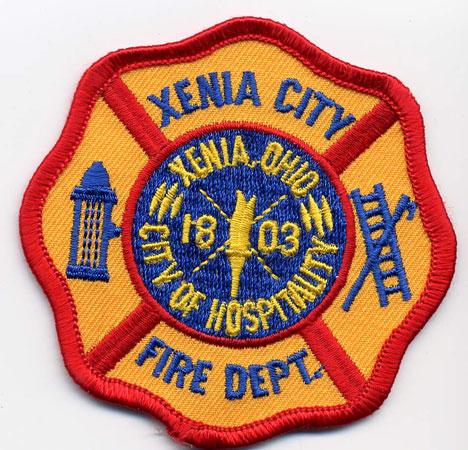 Xenia City - Distintivo giallo con diciture blu
