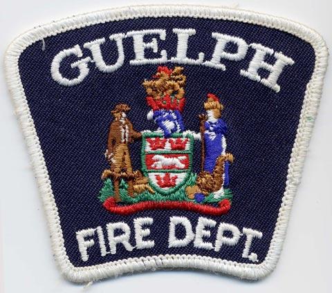 Guelph - Distintivo blu con al centro uno scudo bianco e rosso