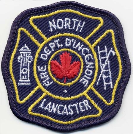 North Lancaster - Distintivo nero con diciture gialle e una foglia rossa al centro