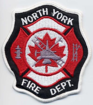 North York - Distintivo nero con al centro un elmo su sfondo rosso