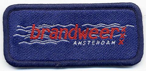 Amsterdam - Distintivo blu con al centro onde bianche