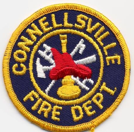 Connellsville - Distintivo blu con al centro un elmo rosso