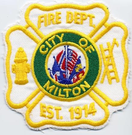 Milton - Distintivo bianco con diciture gialle