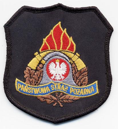Lubaczow - Distintivo nero con al centro un elmo su sfondo di fiamme
