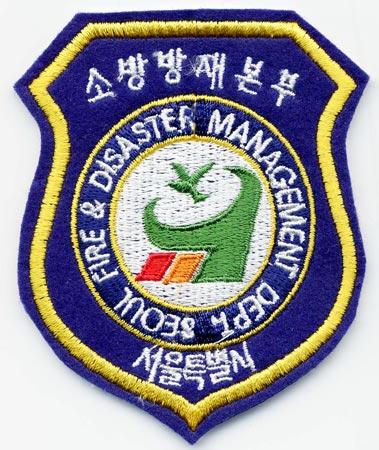Seoul - Distintivo blu con diciture bianche