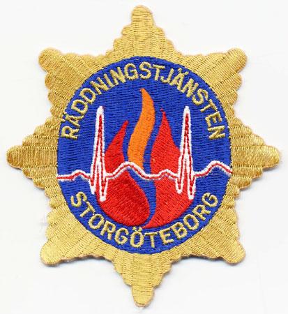 Storgoteborg - Distintivo a stella giallo con al centro fiamme su sfondo azzurro