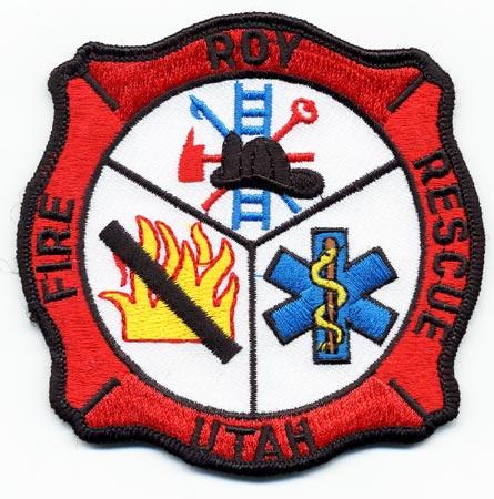 Roy - Distintivo rosso e bianco con al centro un elmo e la croce medica azzurra