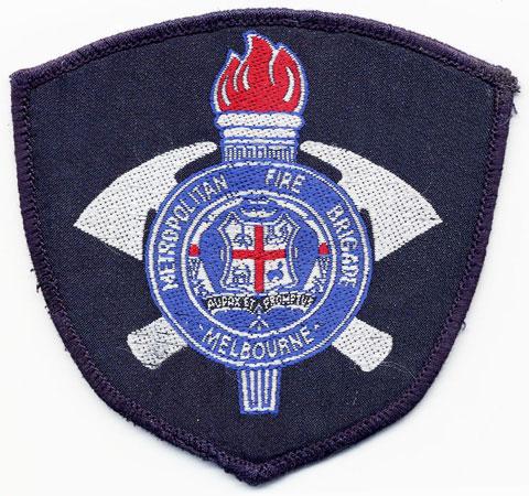 Melbourne - Distintivo blu con al centro una fiamma